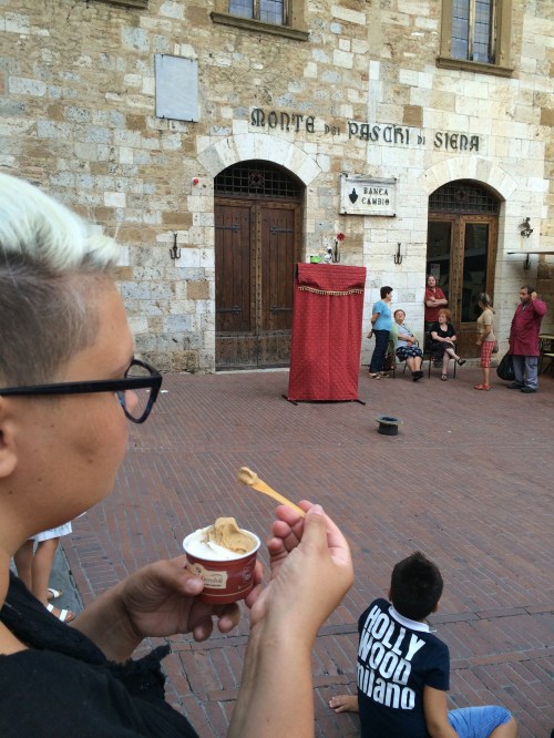 watching a puppet show and eating gelato just like all the kids